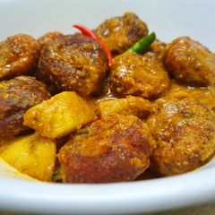 A picture of Traditional Bengali Chanar Dalna or Cottage Cheese Kofta Curry.