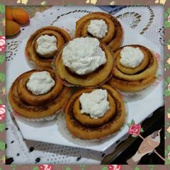 A picture of Cinnamon roll with cream cheese.
