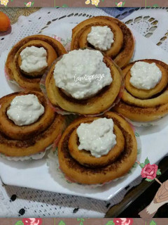 A picture of Cinnamon roll with cream cheese.