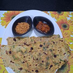 A picture of Healthy Fresh coriander leaves and curd paratha.