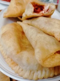 Foto di Panserotti con mozzarella pomodoro e prosciutto cotto fritti