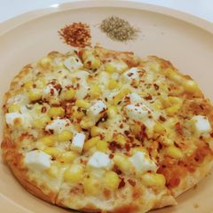 A picture of Corn paneer pizza.