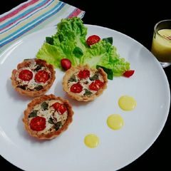 Tomato basil tarts with creamy saffron sauce A picture of Tomato basil tarts with creamy saffron sauce.
