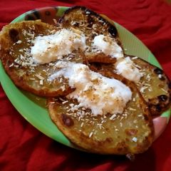 A picture of Wheat flour jaggery pancakes.