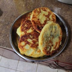 A picture of Ground beef filled pancakes.