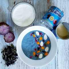 A picture of Purple yam kheer with Butterfly pea flower.