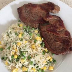 A picture of Coriander and Veg Rice with Peppered Lamb Steaks.