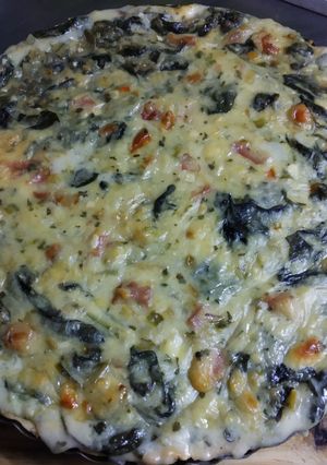 Una foto de Tarta rellena de espinaca, lomito y quesos