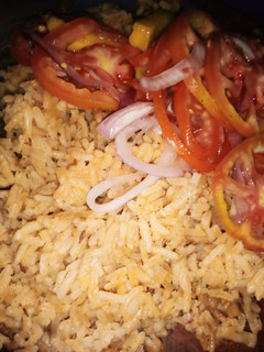 A picture of Mbuzi pilau with mango kachumbari.