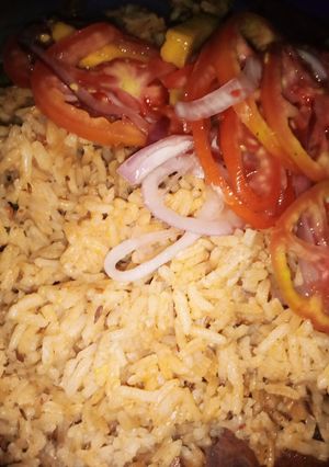 A picture of Mbuzi pilau with mango kachumbari.