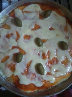 Una foto de Pizza con masa batida