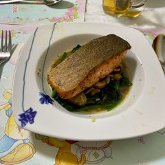 A picture of Pan-seared salmon with lemon butter sauce.