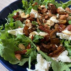 A picture of Grilled mushroom and mozzarella cheese salad with soy sauce.