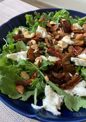 A picture of Grilled mushroom and mozzarella cheese salad with soy sauce.
