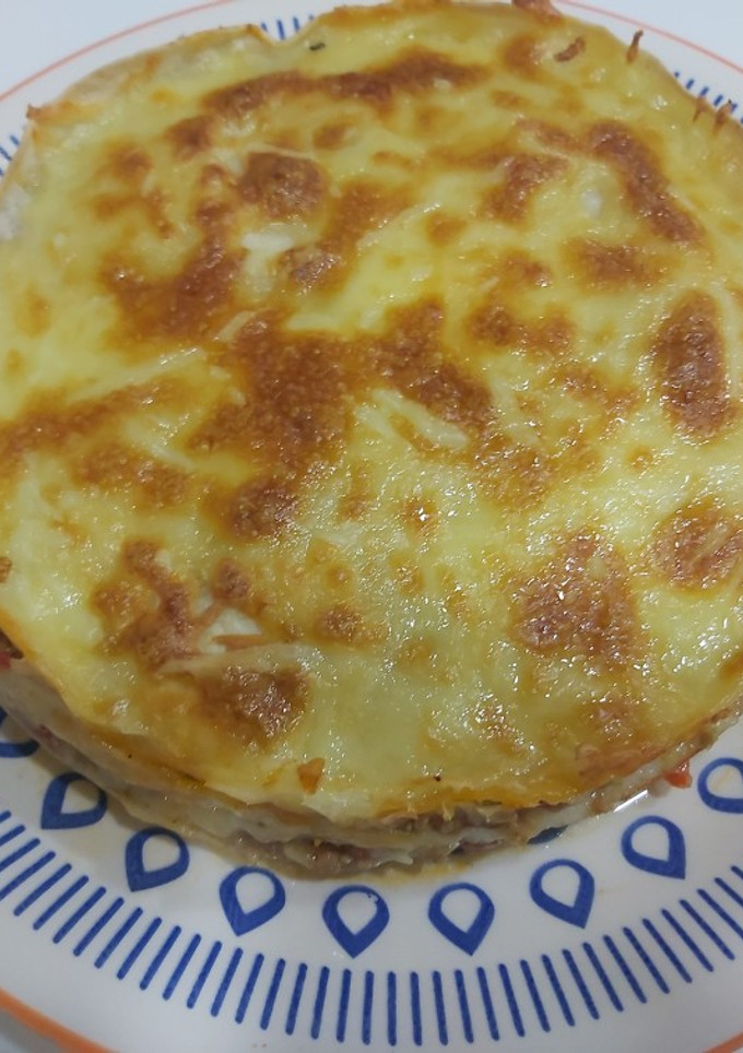 Una foto de Lasaña de tortilla con boloñesa