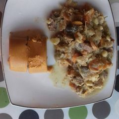 A picture of Moi moi with Irish potatoes sauce.