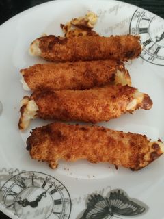 Una foto de Rollitos de jamón York y queso en freidora sin aceite