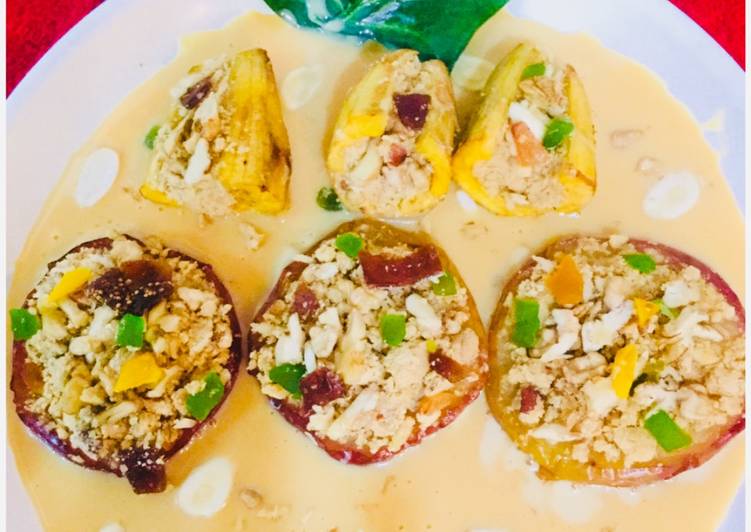 Dry fruits stuffed baked apples and bananas in Rabri