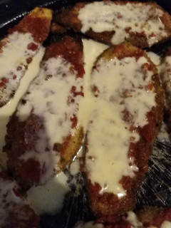 Una foto de Milanesas de berenjena a la napolitana
