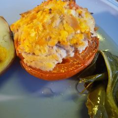 A picture of Roasted Tuna Stuffing in a Tomato.