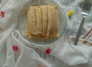 A picture of Patishapta/ Bengali Pancake Roll.