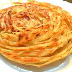 A picture of Layered Masala Laccha Paratha.