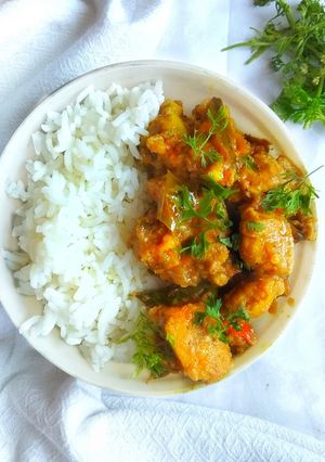 A picture of Authentic Chicken Dry Curry with Rice Bowl.