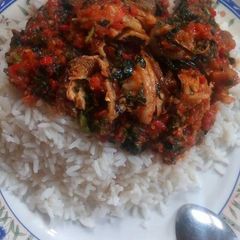 A picture of White rice with vegetable sauce.
