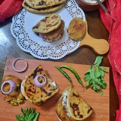 A picture of Whole-wheat no yeast Crispy Kulcha Sandwich with Veg Cutlet.