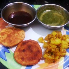 Moong Daal khasta, aloo sabji, red and green chutney A picture of Moong Daal khasta, aloo sabji, red and green chutney.