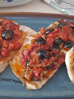 Una foto de Merluza con salsa puttanesca