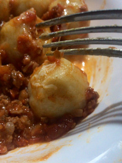 Una foto de Ñoquis rellenos de mozzarella