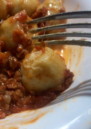 Una foto de Ñoquis rellenos de mozzarella