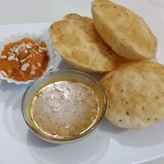 A picture of Daal kachori with Tarkari.