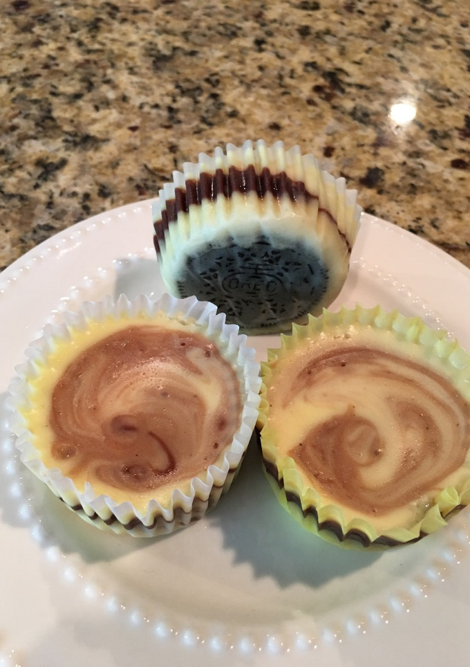 A picture of Fudge Swirled Oreo Bottom Cheesecake Cupcakes.