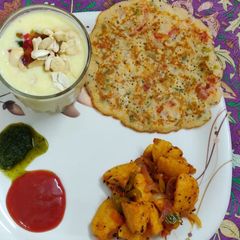 Veggie Loaded Uttapam A picture of Veggie Loaded Uttapam.