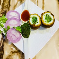 A picture of Cheese spinach egg chicken burst balls.