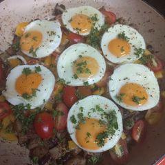 A picture of Mediterranean potato hash with red kidney beans and fried eggs.