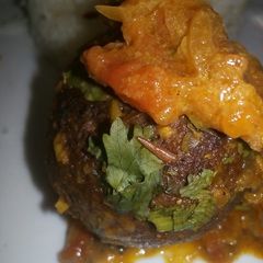A picture of Omena balls in coconut sauce.