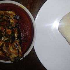 A picture of Cat fish soup with fufu.