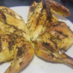 A picture of Flat brined roast chicken with lemon and herbs.