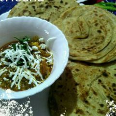 A picture of Paneer with lacha paratha.