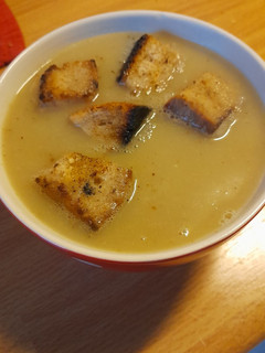 A picture of Chicory and apple soup with croutons.