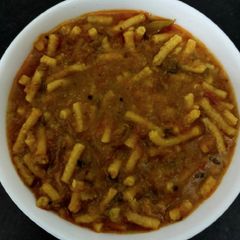 A picture of Jain Sev, Bottl Gourd, Tomato & Red Capsicum Sabji.