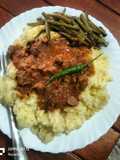 Stewed beef with creamy mashed potatoes served with sauteed buttery string beans