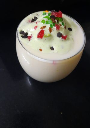 A picture of Mango pista lassi with paan &choco twist.