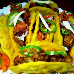 A picture of Rava-Moong Tacos with Stuffed Chicken.