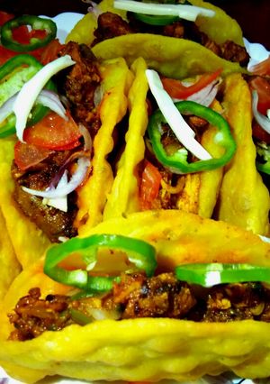 A picture of Rava-Moong Tacos with Stuffed Chicken.