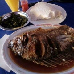 A picture of Fried fish With ugali.