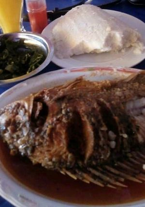 A picture of Fried fish With ugali.